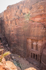 The Petra's Treasury and canyon from above with lot of tourist