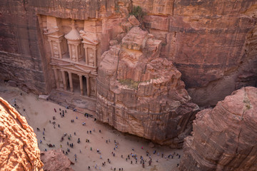 The Petra's Treasury and canyon from above with lot of tourist