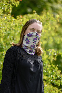 Portrait Of Women Wearing A Face Covering Mask For Virus And Allergies Springtime Hay Fever.