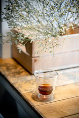 Black filter coffee on the table in cafe glass cup hario pour over cup side