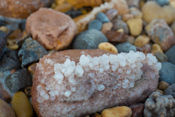 Salty rock oat the Dead sea, precipitated salt mineral from the sea