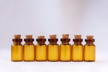 Amber-colored pharmaceutical vials with cork. Copy space