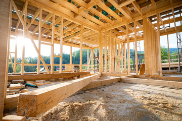 Interior frame of new wooden house under construction - 346170996