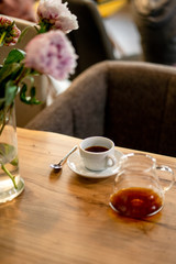 Black filter coffee on the table in cafe glass cup hario pour over cup side