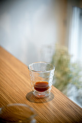 Black filter coffee on the table in cafe glass cup hario pour over cup side