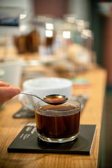 Black filter coffee on the table in cafe glass cup hario pour over cup side
