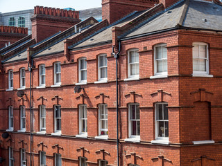 East London, England UK. Traditional red brick housing and flats. Sash windows and slate roof. Concept, buying, renting, estate agent, urban housing and living in the city, London lockdown, stay home.
