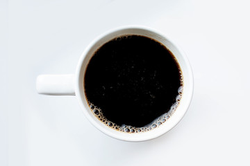 coffee top view. black coffee on a white background. coffee in a white mug.