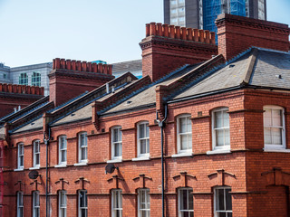 East London, England UK. Traditional red brick housing and flats. Sash windows and slate roof. Concept, buying, renting, estate agent, urban housing and living in the city, London lockdown, copy space