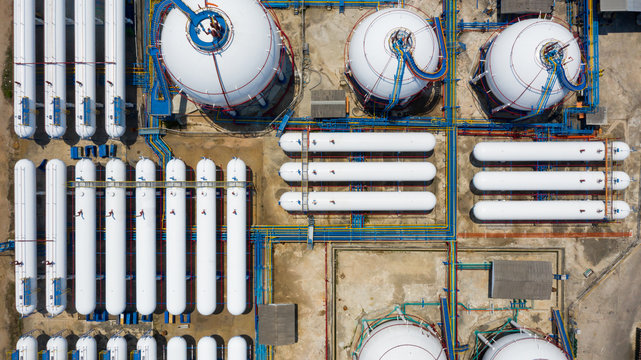 Aerial View White Storage Tank Gas In Station LPG Gas, LNG Or LPG Distribution Station Facility, Oil And Gas Fuel Manufacturing Industry.