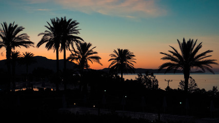 Fototapeta na wymiar Sunset on the beach on Rhodes island, Greece