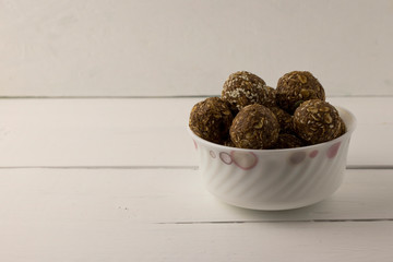 Oat and nut home made energy balls in a bowl