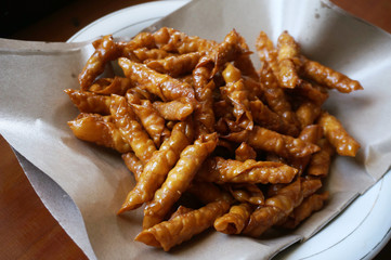 Kacang sembunyi (Indonesian). Popular snack from indonesia. Beans wrapped in a dough skin from flour . Deep fried using oil and  liquid sugar. 