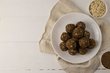 Oat and nut home made energy balls in a white plate