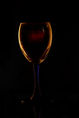 glass fuselage with multicolored glare of light on a dark background