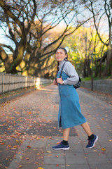 Fototapeta premium Asian woman in autumn nature background at Nagoya of Japan