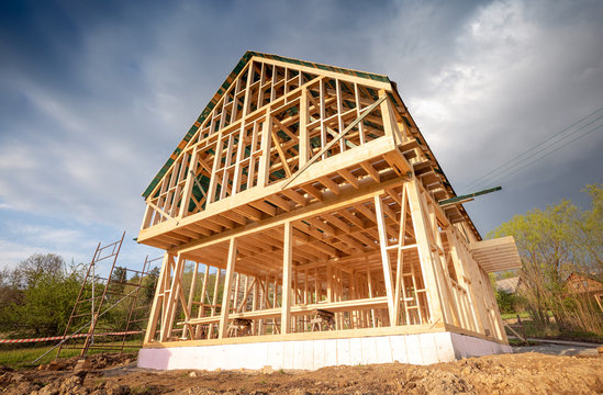 New wooden frame house under construction, outdoor residential home