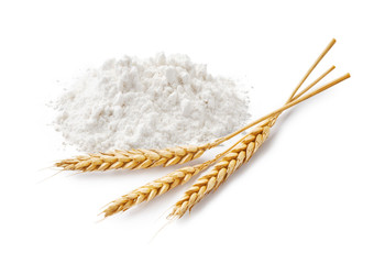 Wheat flour and spikelets isolated on white background.