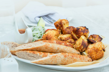 barbecue fried chicken sausages onion ketchup close-up