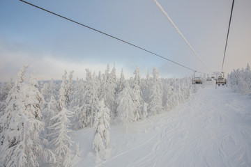 Ski lift in the snow mountains