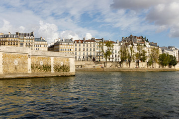 Fototapeta na wymiar Apartment buildings on the Isle St. Louis in Paris, France, along the Seine River