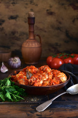 Chakhokhbili - traditional dish of georgian cuisine. Chicken stewed with vegetables : carrot, onion, tomatoes.