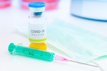 Coronavirus Covid-19 vaccine vial in medical lab, immunization and treatment from coronavirus (Covid-19) medical equipment concept