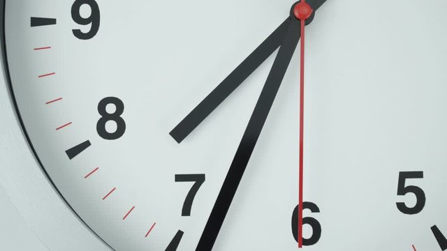 Closeup Gray wall clock shows time 7 o'clock, Time lapse moving fast, Time concept.