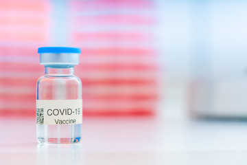 Nobel coronavirus covid-19 vaccine vial, in a biological laboratory with a biological tube for analysis and sampling of Covid-19 infectious disease.
