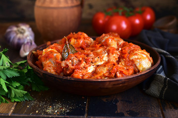 Chakhokhbili - traditional dish of georgian cuisine. Chicken stewed with vegetables : carrot, onion, tomatoes.