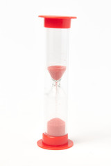 red hourglass on a white background isolate