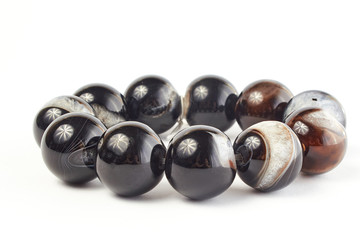 homemade agate beads bracelet on a white background. close up