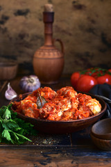 Chakhokhbili - traditional dish of georgian cuisine. Chicken stewed with vegetables : carrot, onion, tomatoes.