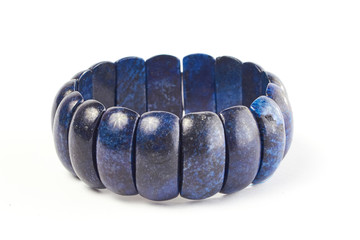 bracelet made of lapis lazuli semiprecious stone on a white background. close up