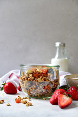 Homemade delicious granola with fresh strawberry  and milk for a breakfast.