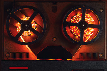 reel to reel audio tape recorder with orange led light strip
