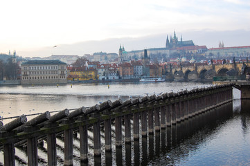 A view of Prague along the river with the castle in the background