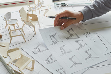 Designer sketching drawing design development product plan draft chair armchair Wingback Interior...