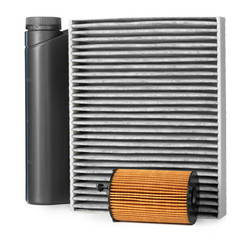Car filters and motor oil can isolated on white, close up.