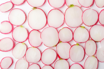 Top view of fresh sliced radishes as a background.Closeup of pieces of radishes
