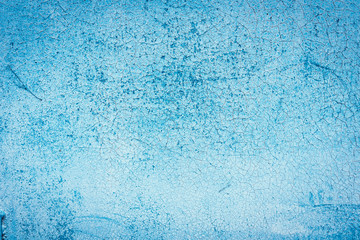 Texture of a rusty metal surface: dark blue, blue, aged cracked paint. Background of old painted sheet metal with rust painted in blue.