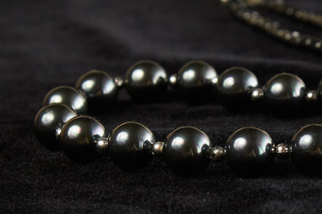 beads from Mallorca semiprecious stone on black velor. close up