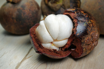 Mangosteen peeled on wood table. Mangosteen queen of fruit.  