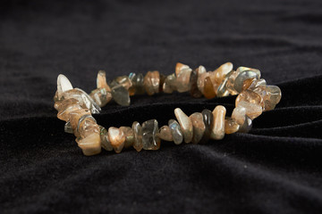 jasper bracelet semiprecious stone on black velor. close up
