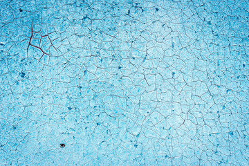 Texture of a rusty metal surface: dark blue, blue, aged cracked paint. Background of old painted sheet metal with rust painted in blue.