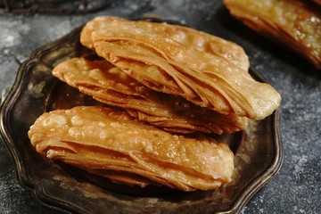 Homemade Indian sweet khaja /chirote or Madakku san, selective focus