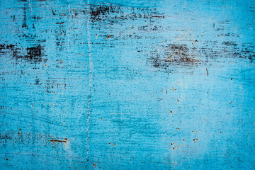 Obraz premium Texture of a rusty metal surface: dark blue, blue, aged cracked paint. Background of old painted sheet metal with rust painted in blue.
