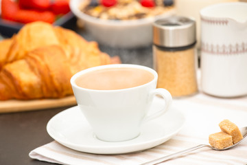 Breakfast Served in the morning with Hot black coffee and croissants Natural corn flake breakfast cereal in cups and fruit on the breakfast table every day