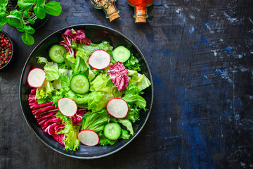 Healthy salad, leaves mix salad (mix micro greens, vegetable juicy snack). food background Image, copy space for text keto or paleo diet
