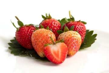 strawberries in a bowl on white background